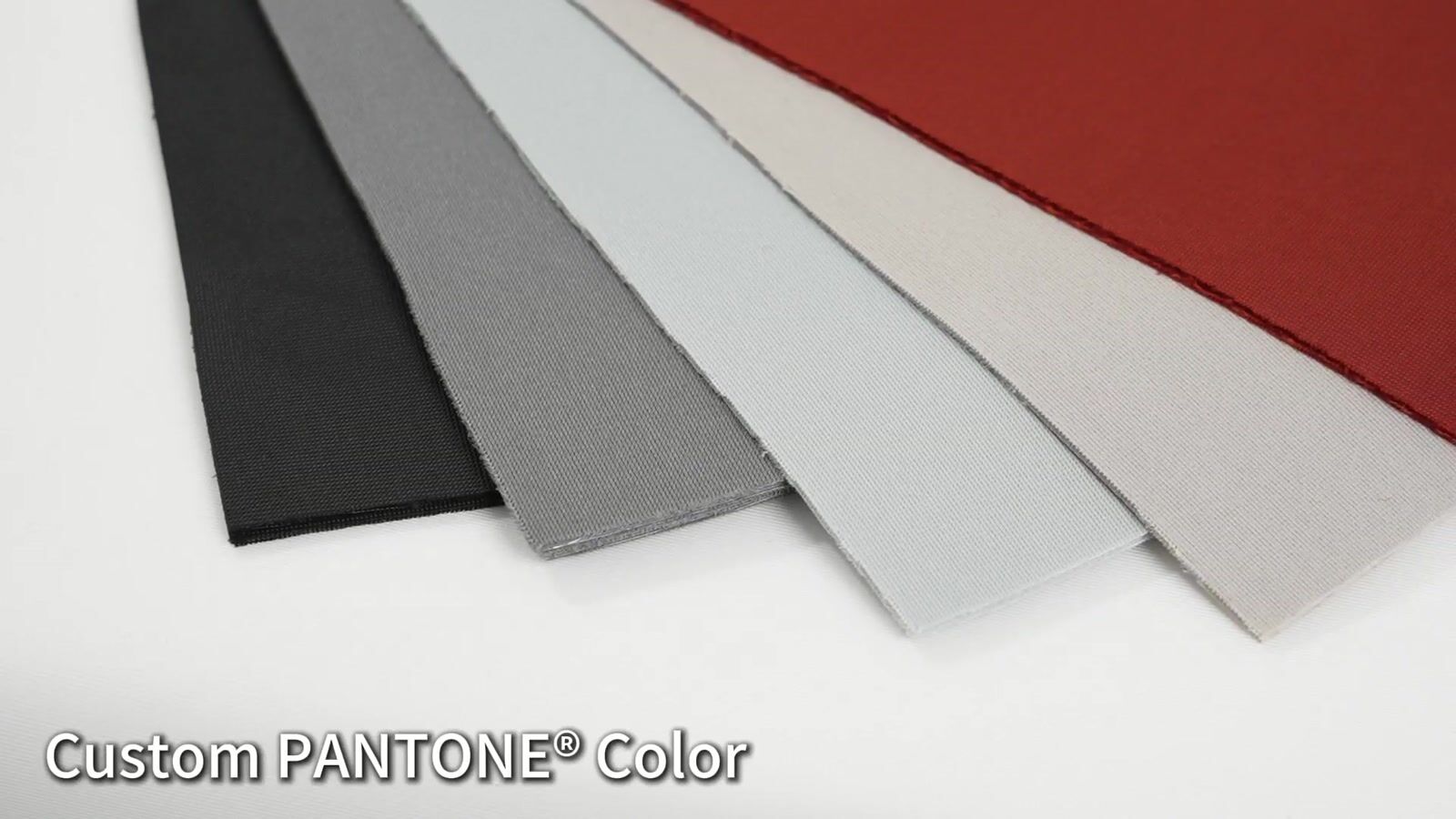 Five actual fabric color samples arranged in a fan